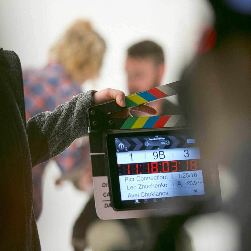 person holding clapperboard